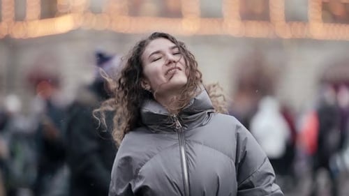 Playful Young Woman on Square of Big City People with Protective Face Masks at Pandemic