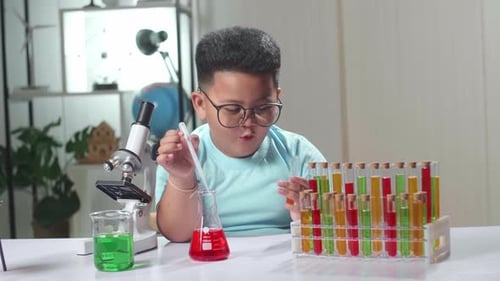 Enthusiastic Child Doing a Science Experiment