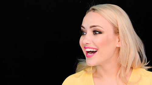 Excited Blond Woman With A Look Of Amazement