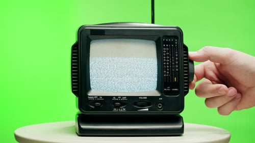 Small Old Television with Grey Interference Screen on Chroma Green Background