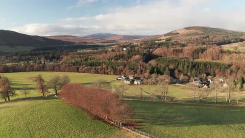 Flying over the beautiful countryside of Scotland with mountains in the background