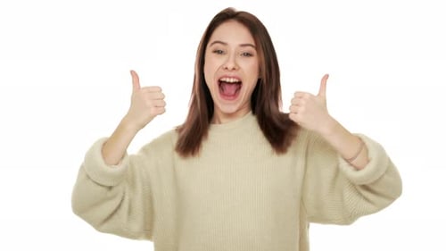 Young Woman Gives Two Thumbs Up Smiling