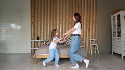 Mother and Preschooler Daughter Perform Dancing Moves