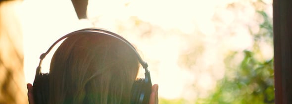 Girl Listening To Music In Headphones Outdoor