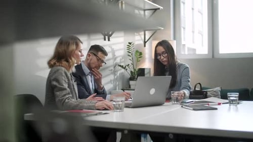 In Creative Office Productive Coworkers Standing at the Table, Company Meeting