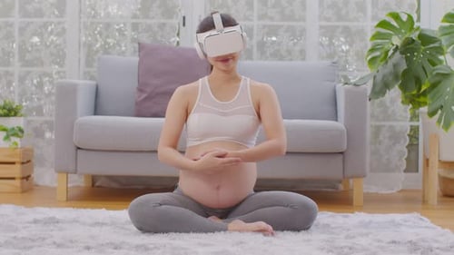Pregnant Woman Using VR Headset Meditating