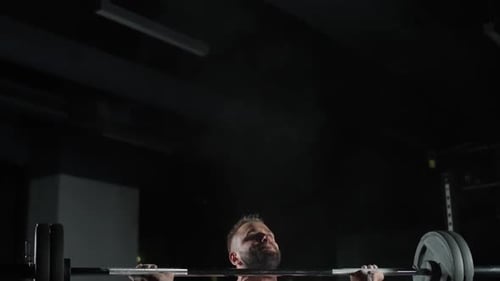 Caucasian Athletic Man Performs Exercises with Barbell Lifts Barbell and Does Weights Training in