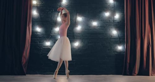 Professional Dancer Rehearses a Choreographic Dance Backstage a Dark Studio