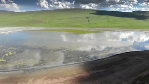 Lake in The Middle of The Treeless Meadow with Aerial View