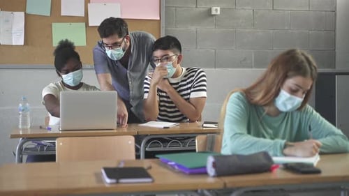 Teacher Helping Students Learning at High School