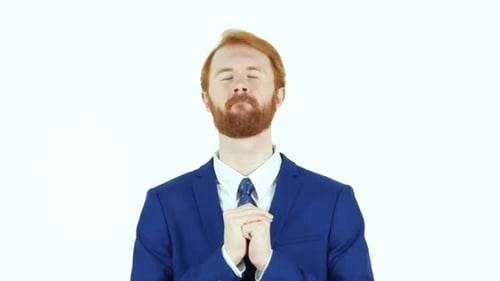 Red Haired Man Prays Wearing Suit