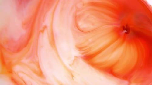 Abstract Swirling Red and White Paint Mixing