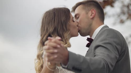 Lovely Caucasian Wedding Newlyweds Family Bride Groom Holding Hands Making a Kiss on Mountain Slope