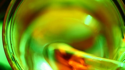 Colorful Liquid Being Poured into Glass Bowl