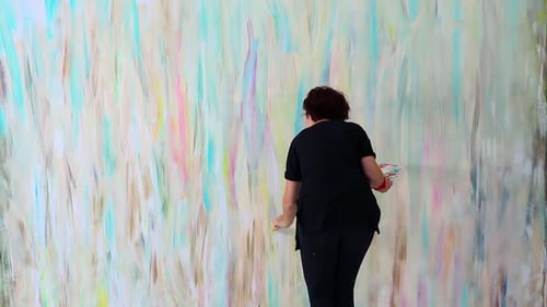 Artist Painting Abstract Design on Large Canvas