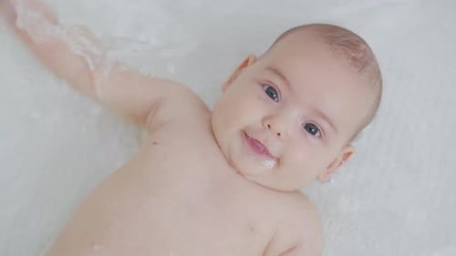 Delightful Baby Smiling in the Bath