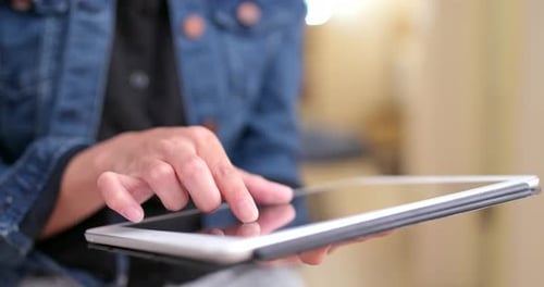Close up of woman using digital tablet