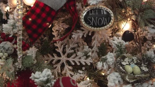 Panning view of christmas decor on tree