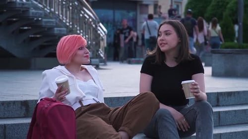 Young Women Laughing and Talking in the City