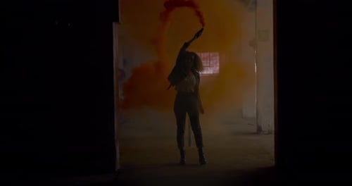 Fashionable young woman in an abandoned warehouse