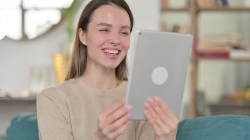 Young Woman Video Calling on Tablet Device