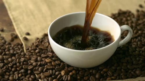 Fresh Coffee Being Poured Into a Cup