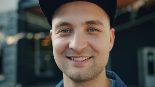 Close-up Portrait of Attractive Adult Man Smiling Standing Outdoors in Street