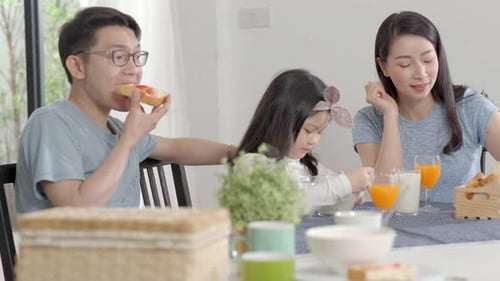 Family Enjoys Breakfast Together at Home