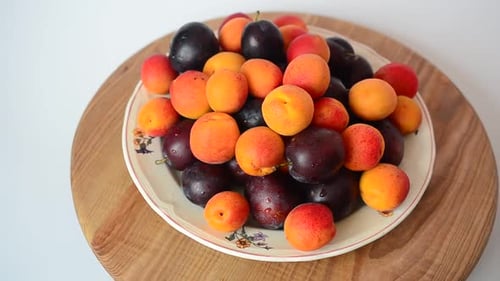 Apricots and Plums on a Plate Rotating
