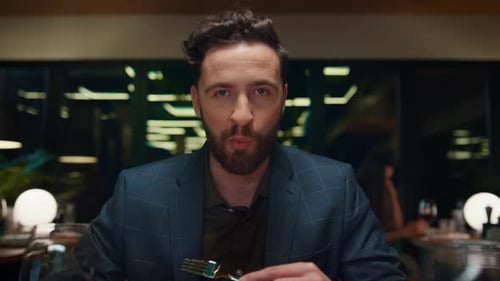 Sexy Man Eating Restaurant Food on Romantic Dinner Date