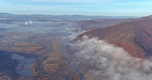 Morning Fog the Autumn Foliage with Valley Between Mountais