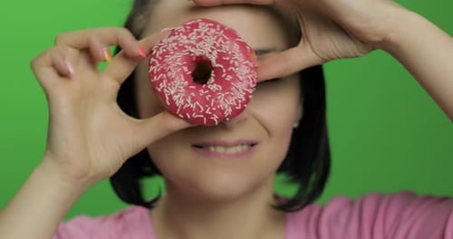 Happy Beautiful Young Girl Posing and Having Fun with Donut. Chroma Key