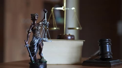 Scales of Justice with Gavel and Statue