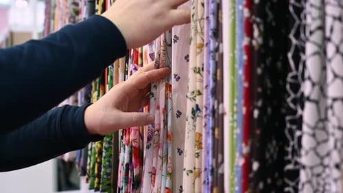 Selecting Colorful Patterned Fabrics in a Retail Store