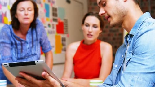 Coworkers Collaborating in Modern Office Setting