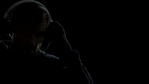 Male in Headphones Listening Sound, Looking Into Future Innovation Progress