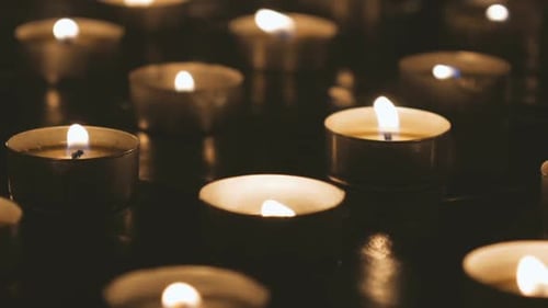 Many Candles Burning in the Dark