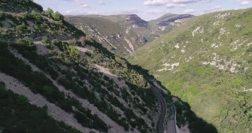Drone Shot Flying Over Beautiful Mountain Ridge and Clouds in Rural Environment