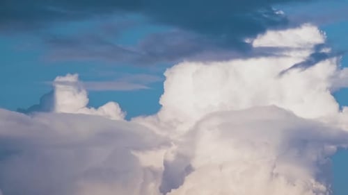 Timelapse of White Puffy Cumulus Clouds Forming on Summer Blue Sky