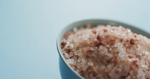 Pink Himalayan Salt Filling Blue Bowl