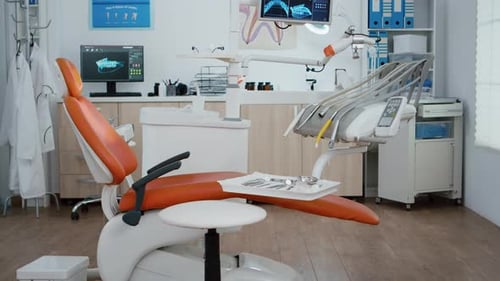 Interior of Modern Equipped Dental Office with x Ray on Monitors