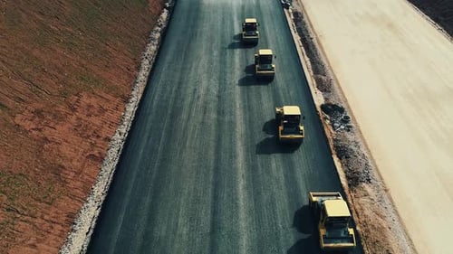 The Road Roller is Laying Asphalt