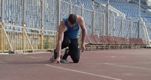 Young Sprinter Preparing to Run