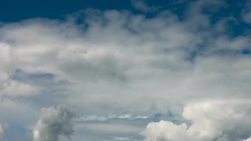 Time Lapse of Dramatic Clouds Across Blue Sky