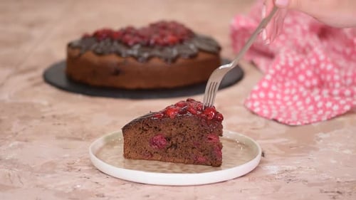 Decadent Chocolate Cherry Cake Slice Being Eaten