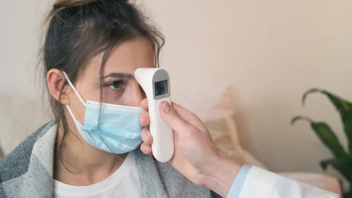 The Doctor Measures the Temperature of a Noncontact Infrared Thermometer