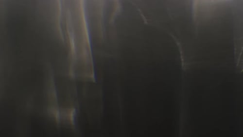 Abstract Dark Background with Vertical Dancing Light