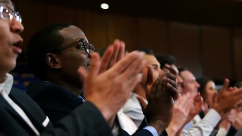 Audience Clapping at Business Conference Indoors