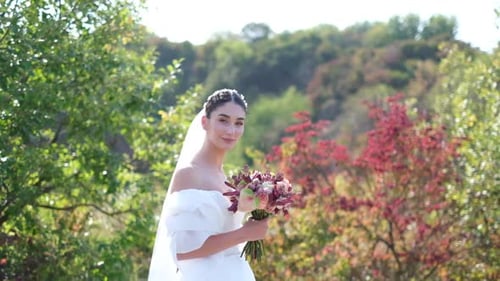Happy Bride in White Stylish Dress with Wedding Bouquet Beautiful Forest