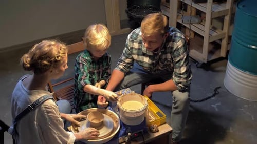 Family Crafting Pottery Together